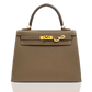Brown handbag with gold hardware on a white background, collection-preview