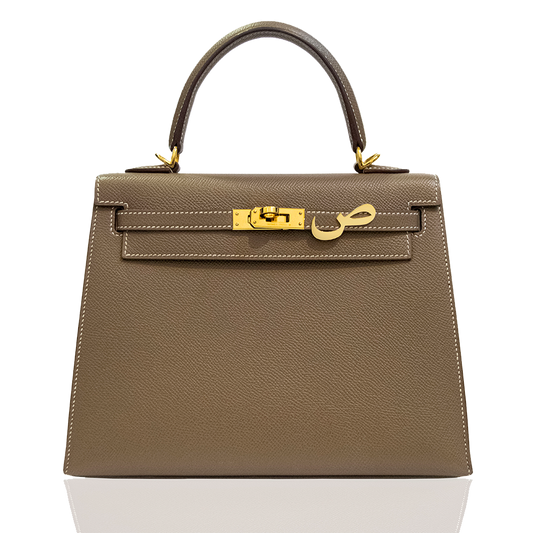 Brown handbag with gold hardware on a white background, collection-preview